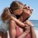 Lifestyle photo of mother and daughter having fun at the beach