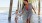 Lifestyle photo of a family running under a pier by the beach