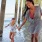 Lifestyle photo of a family running under a pier by the beach