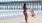 Lifestyle photo of family playing on a beach