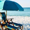 Beachfront umbrella and chairs